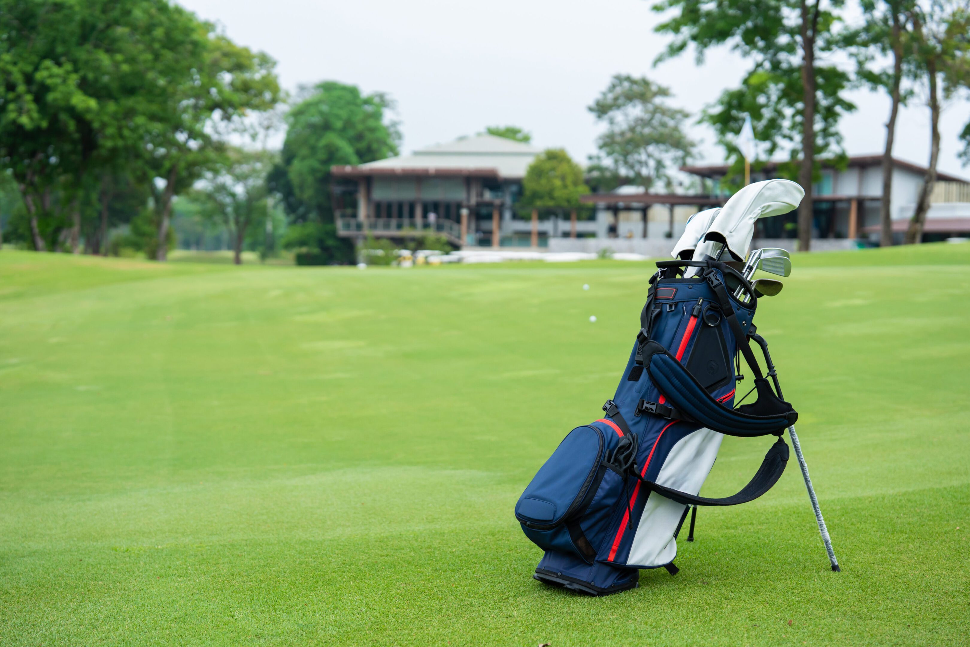 Golf bag on green golf course.