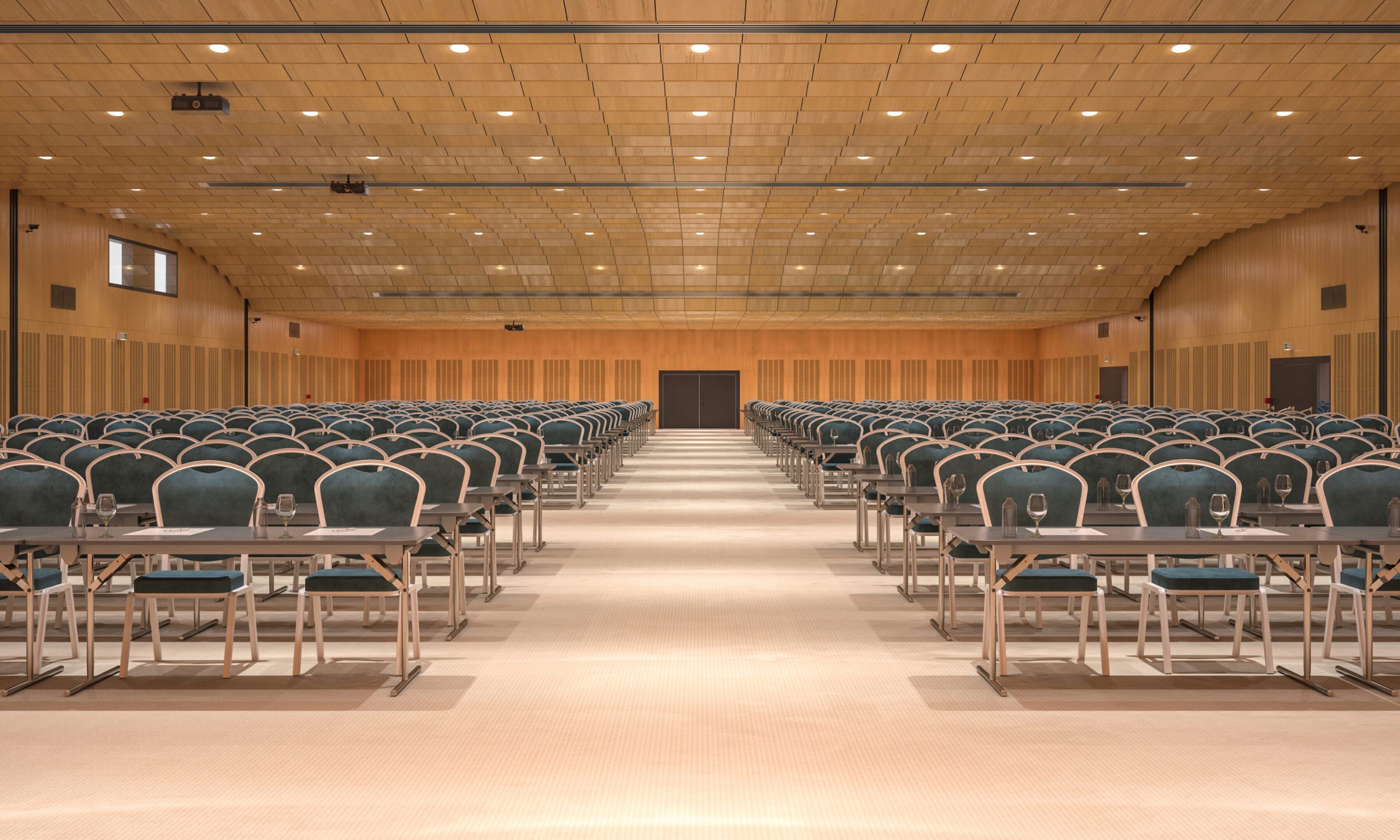 Empty conference hall with rows of chairs.