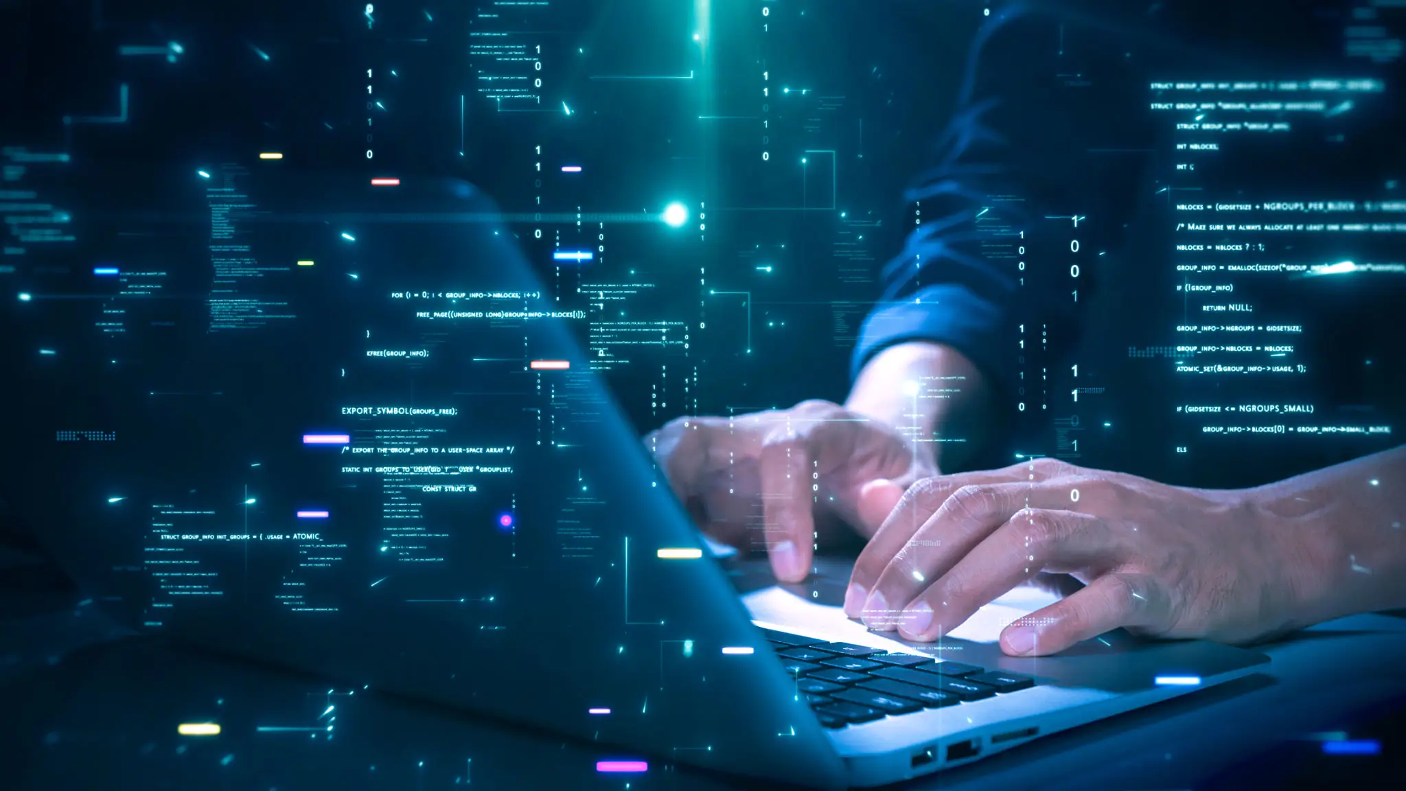 Hands typing on laptop with digital code.